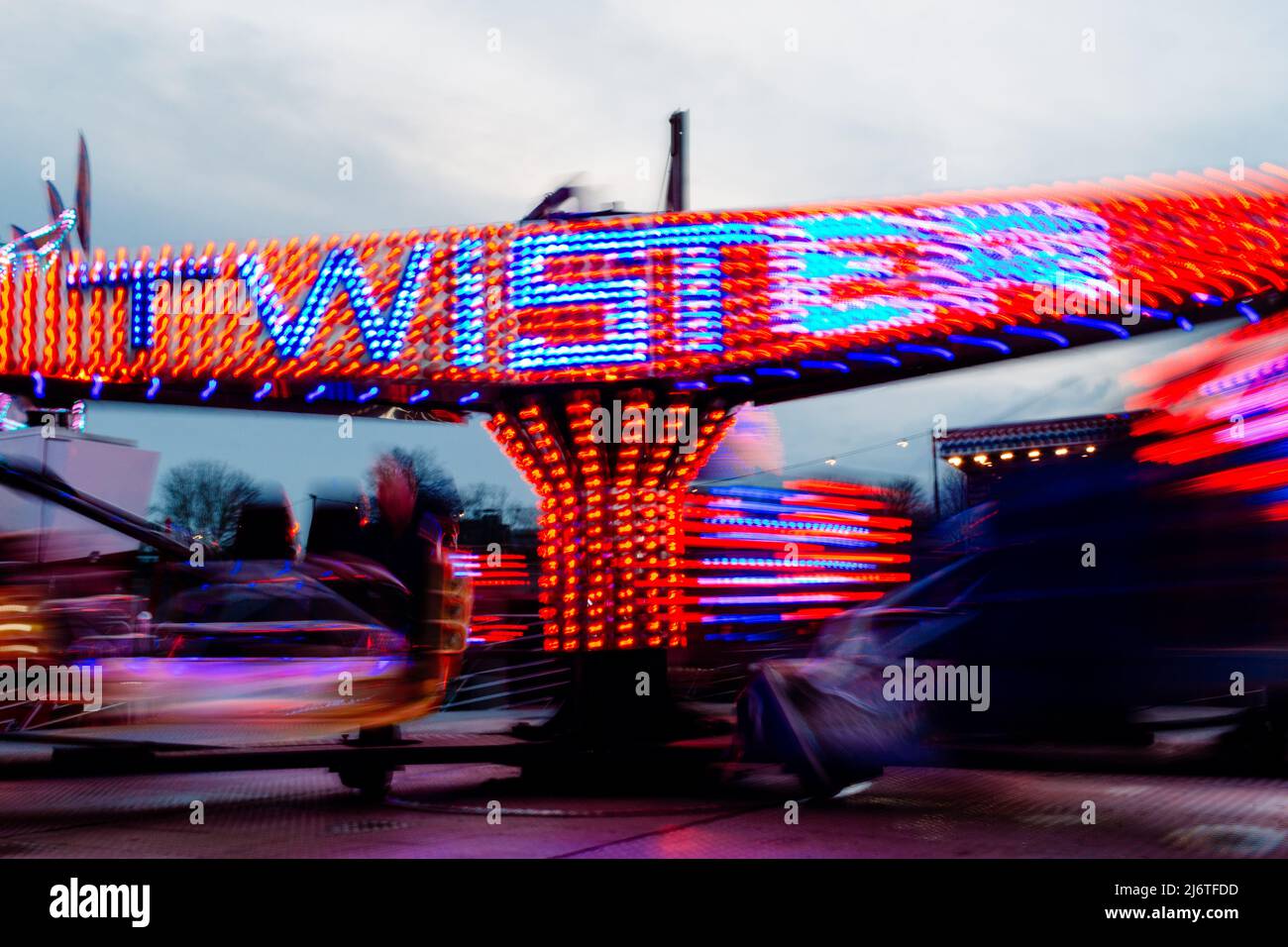 The Twister fairground ride twirls around. Stock Photo