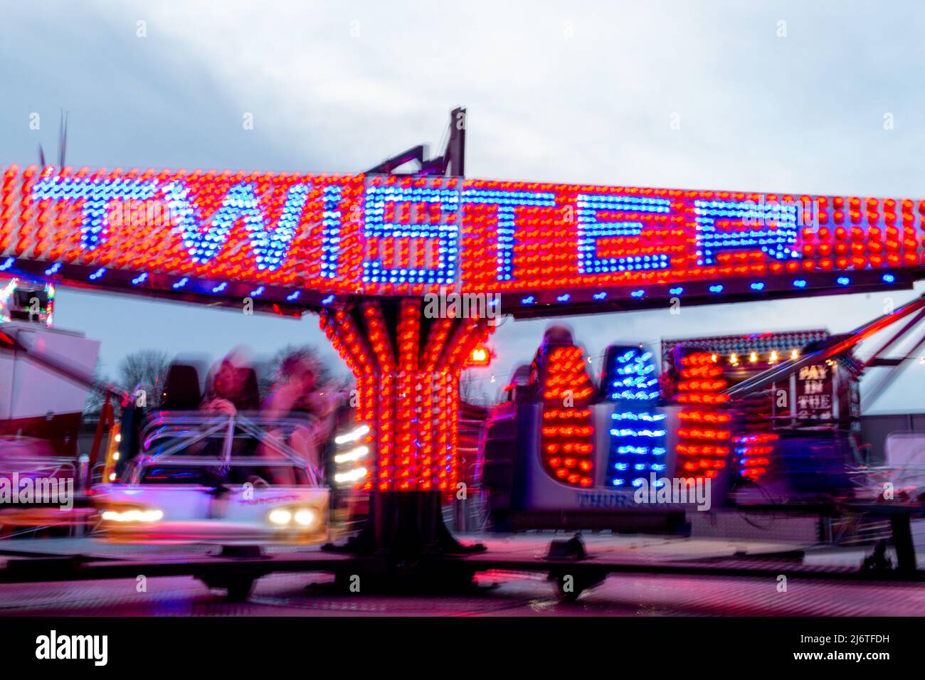 The Twister fairground ride twirls around. Stock Photo