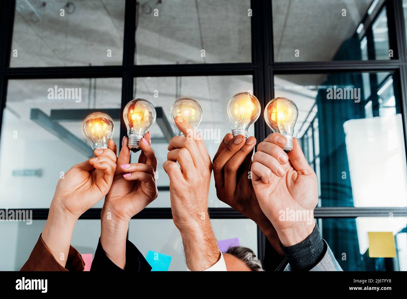 Teamwork and brainstorming concept with businessmen that share an idea ...