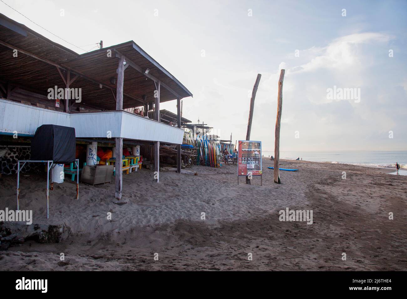 The Sand Bar cafe at Batu Bolong Beach in Canggu, Bali with surfboard