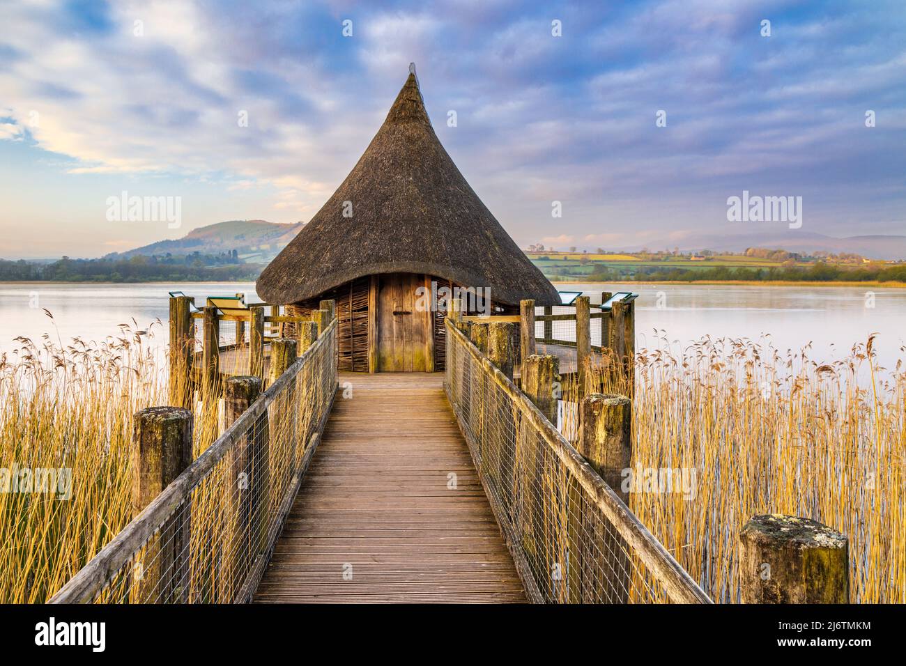 The Crannog at Llangorse Lake in the Brecon Beacons National Park, South Wales, captured just after sunrise. Stock Photo
