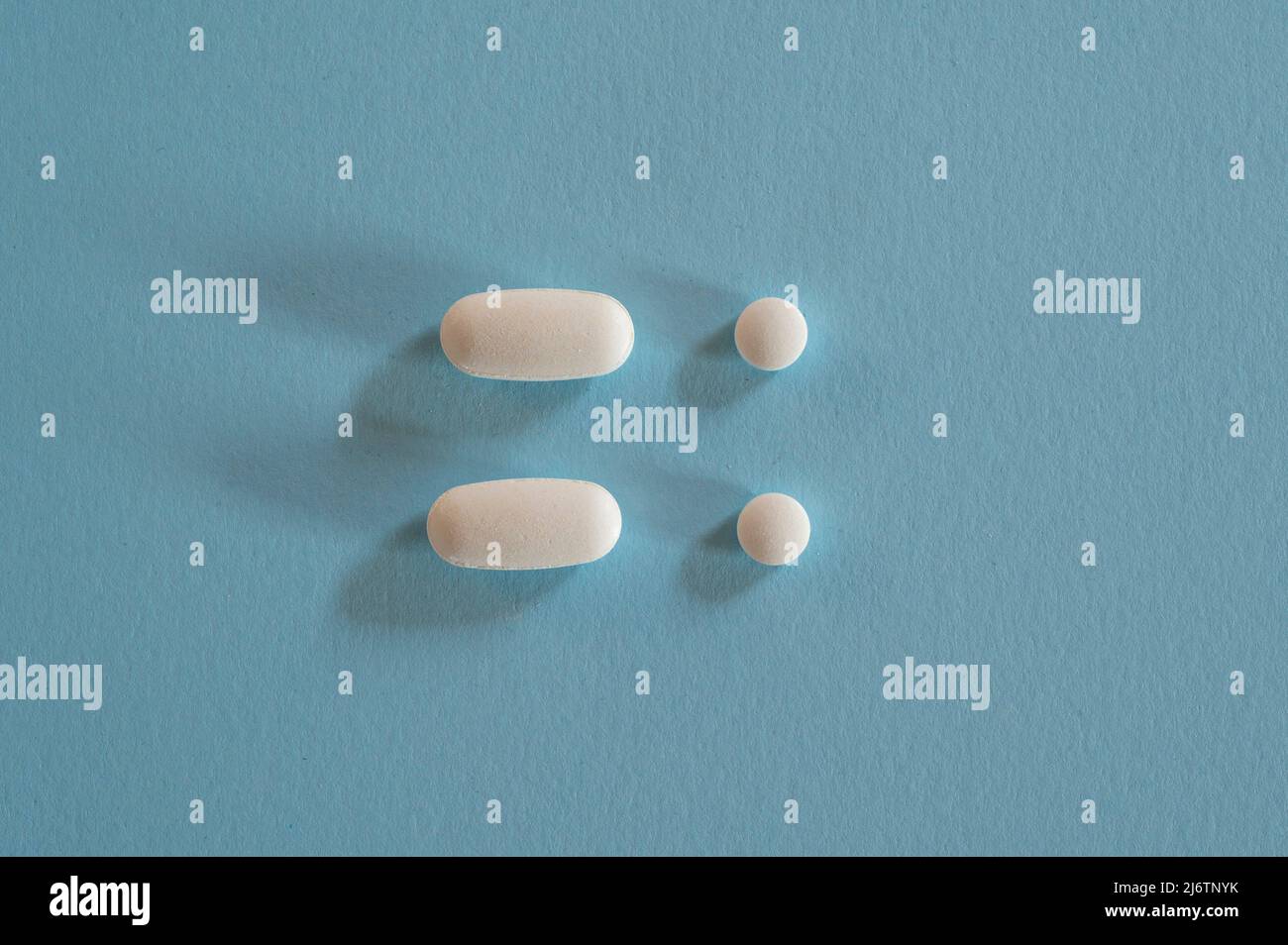 Closeup of with pills on blue background Stock Photo