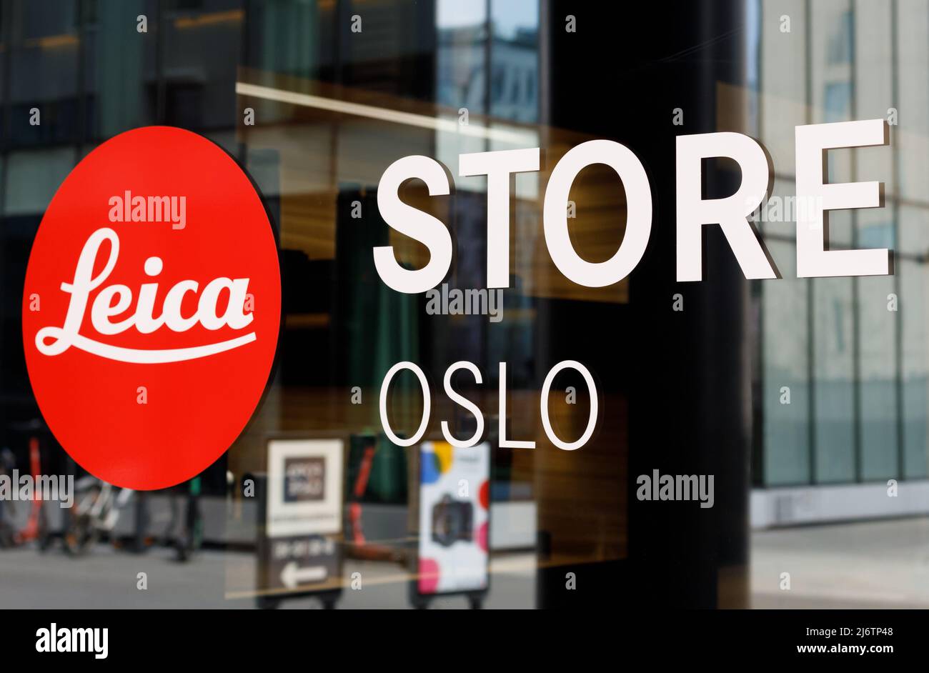 Norway, Oslo - May, 02, 2022: Close-up of Leica logo on glass on front of Oslo store. Logotyp Leica Stock Photo