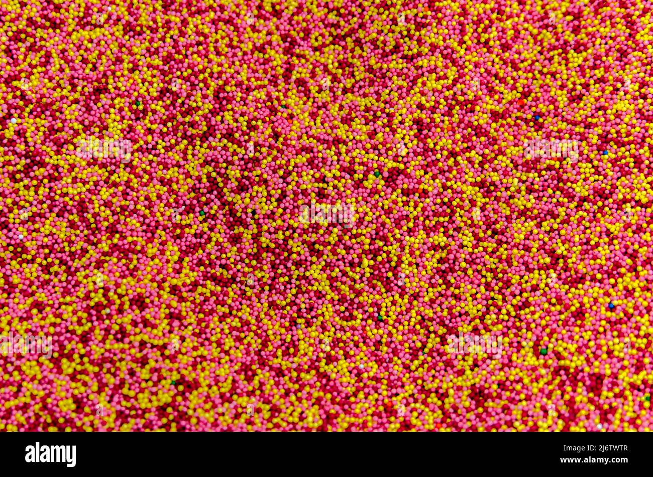 Multicolored background from sugar powder for Easter Stock Photo - Alamy