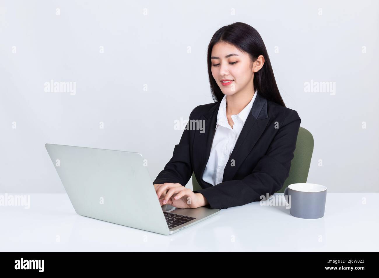 business woman sit at desk in office Stock Photo - Alamy