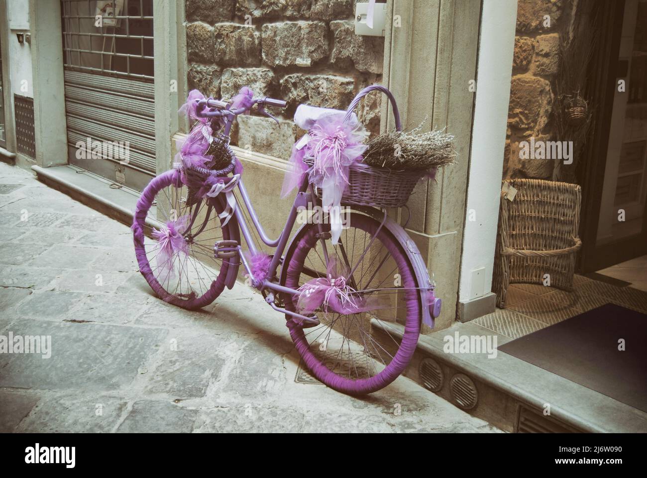 Vintage pink bike in the street Stock Photo