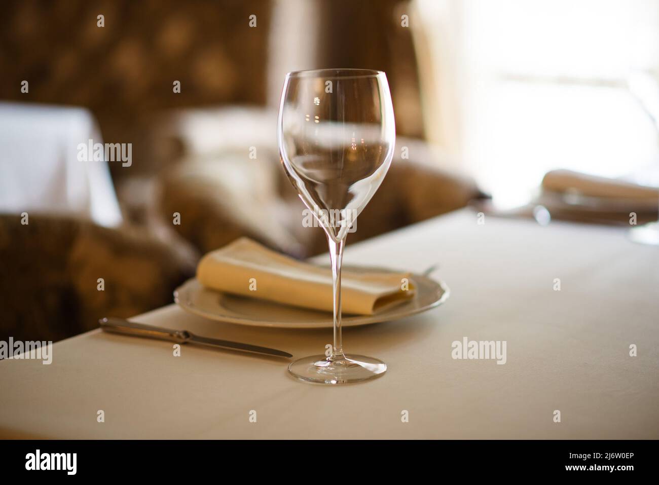 Table setting with an empty glass for wine Stock Photo