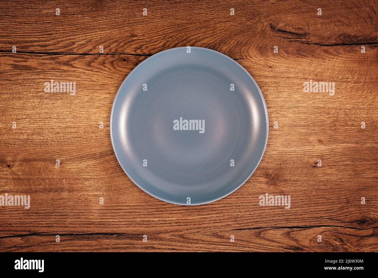 Empty plate on dining room table, top view Stock Photo