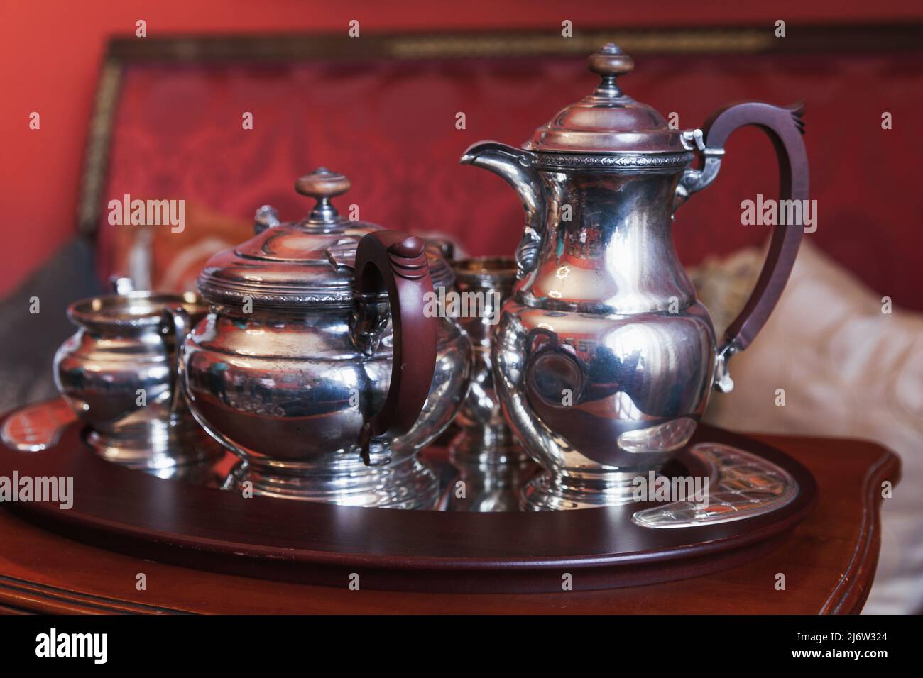 Silver tea set stands on a tray, luxury vintage silverware Stock Photo