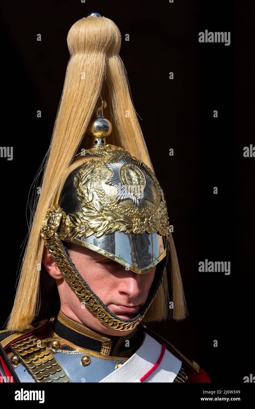 British Army Life Guards of Household Cavalry soldier on ceremonial mounted guard duty at Horse Guards, London, UK. Polished helmet with plume Stock Photo