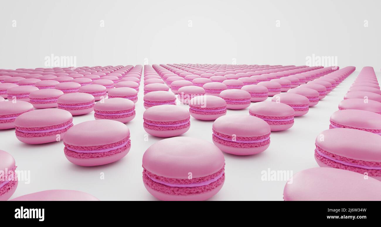 many pastel pink macarons distributed in lines on white background ...
