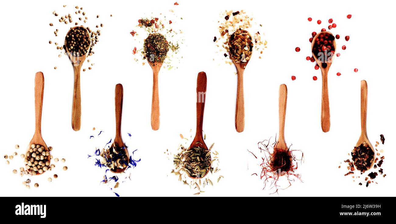 Collection of Spices in Wooden Spoons White Pepper, Coriander, Ginger
