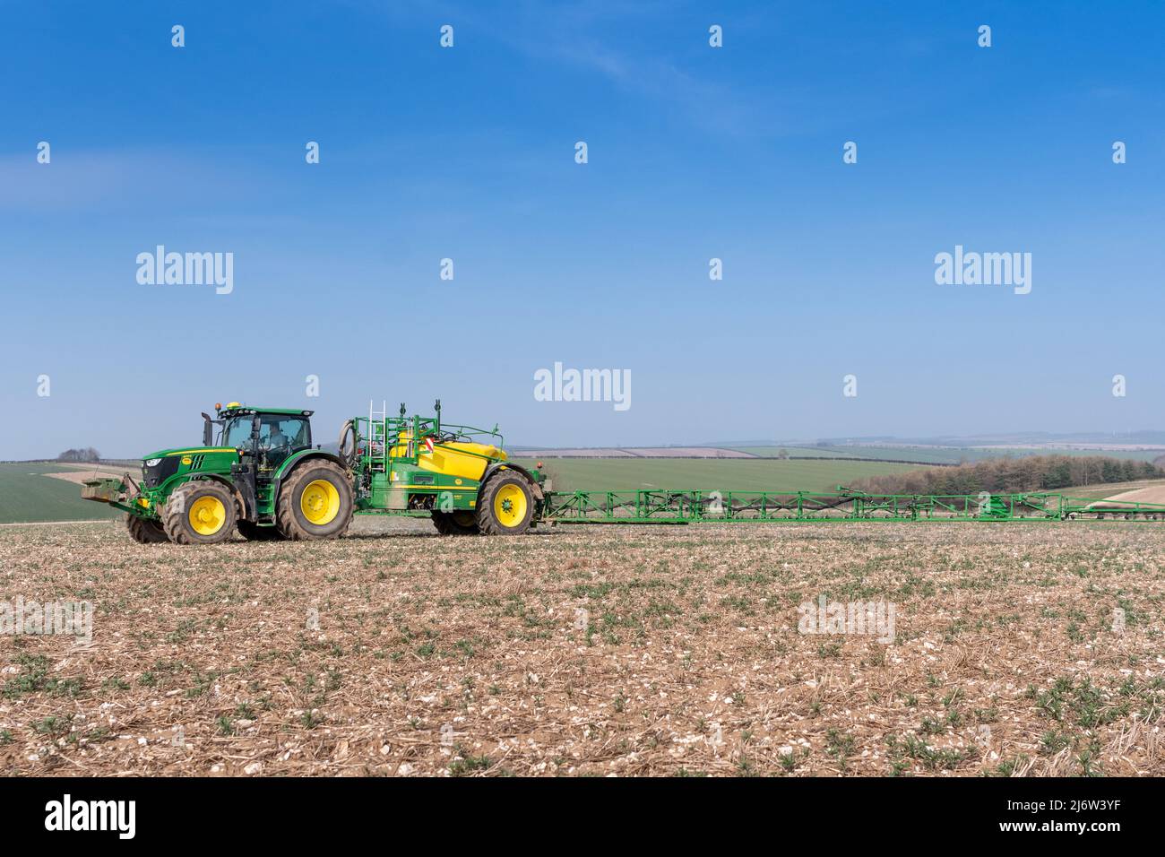 Spraying arable crop on the Yorkshire Wolds near York, using a John