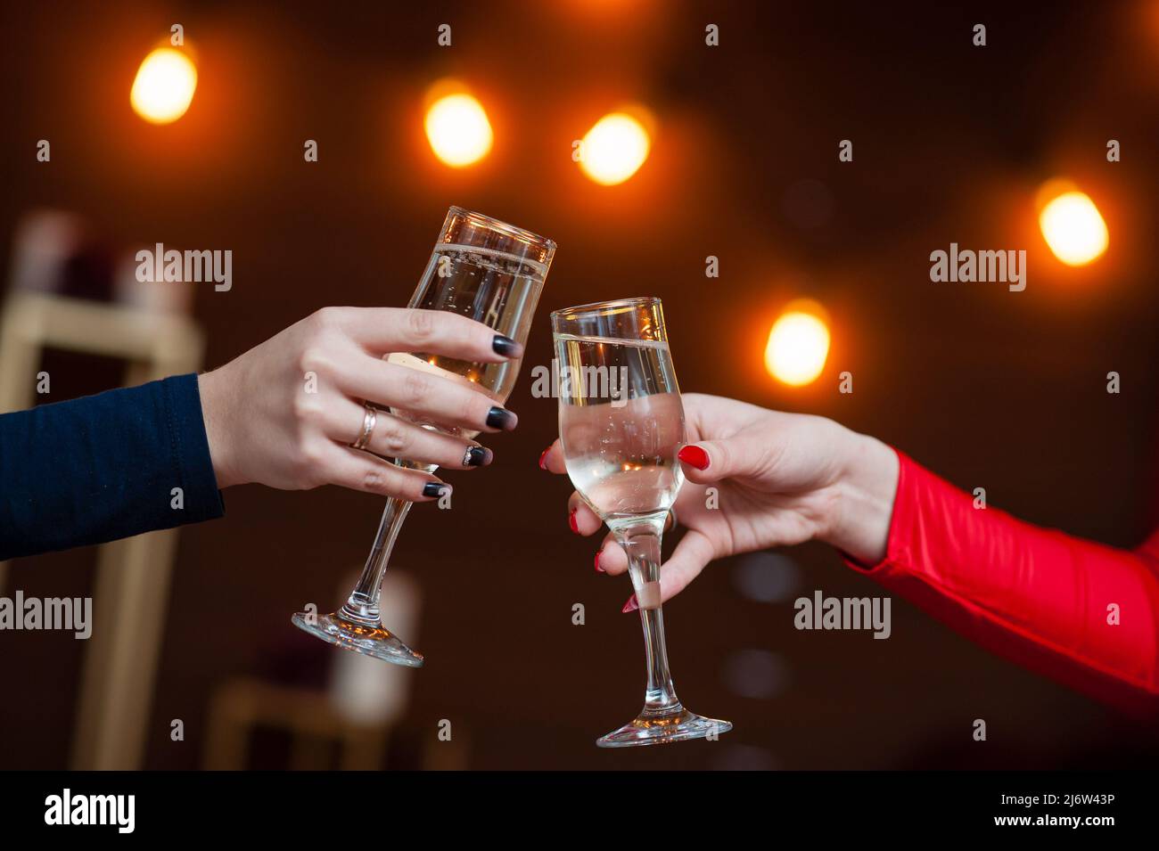Celebration. People holding glasses of champagne making a toast Stock ...