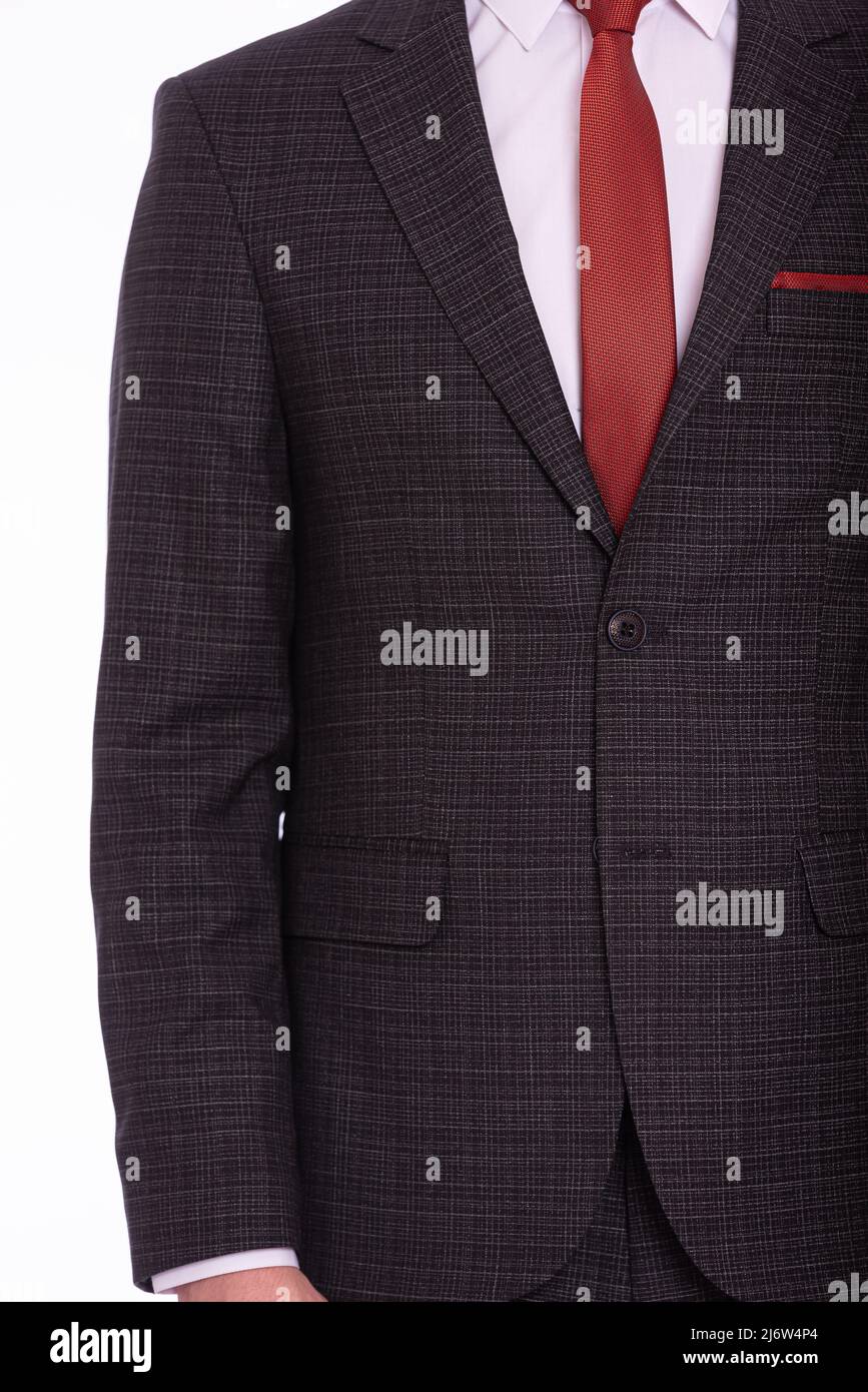 suit and white shirt and red tie 