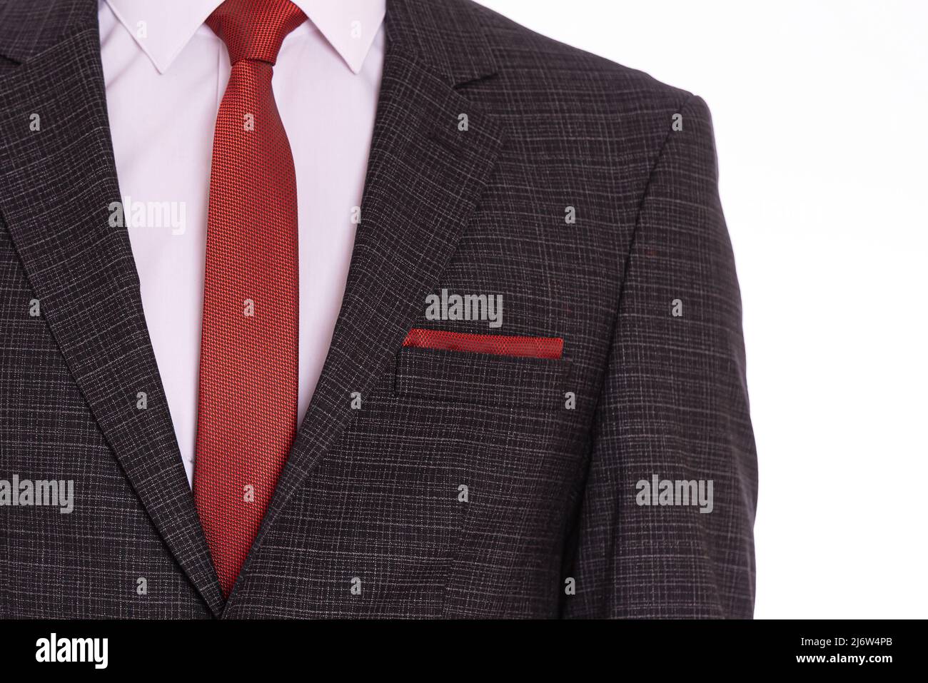suit and white shirt and red tie 
