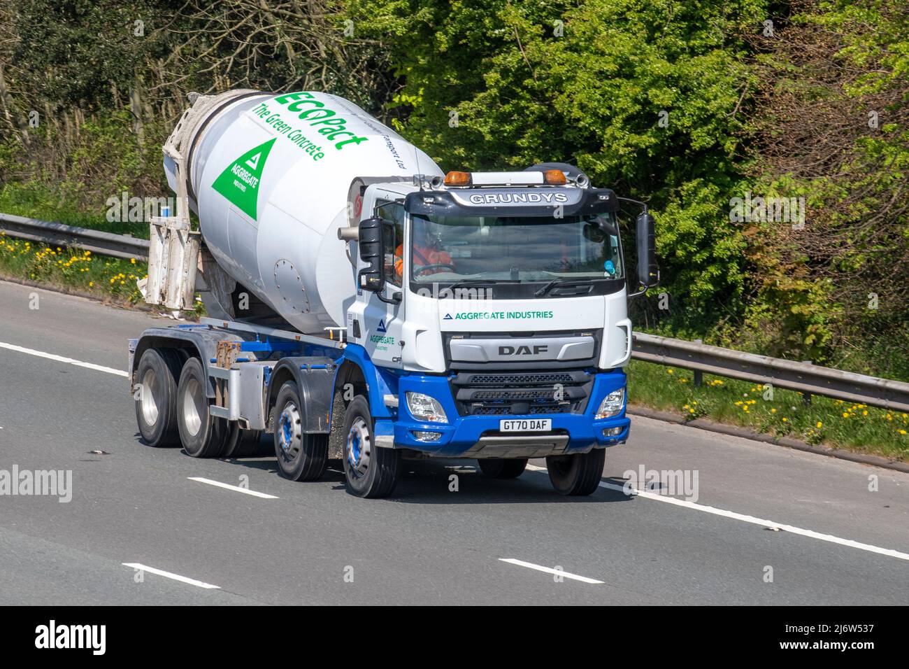 GRUNDY'S haulage EcoPact Aggregate Industries green concrete DAF CF cement mixer driving on the