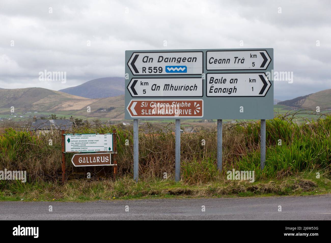 Bilingual signs in a beautiful landscape in the West Kerry Gaeltacht in Ireland Stock Photo