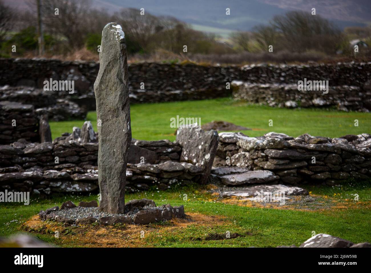 Standing stone at the riasc monastic settlement in Kerry Stock Photo