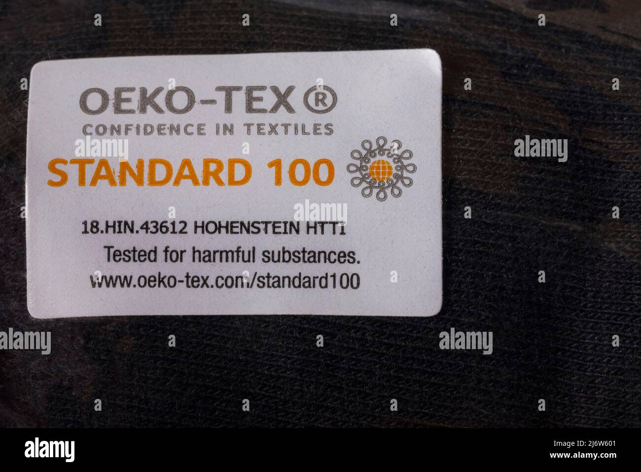 Oeko-tex confidence in textiles Standard 100 tested for harmful substances  - detail on label on textile fabric material Stock Photo - Alamy