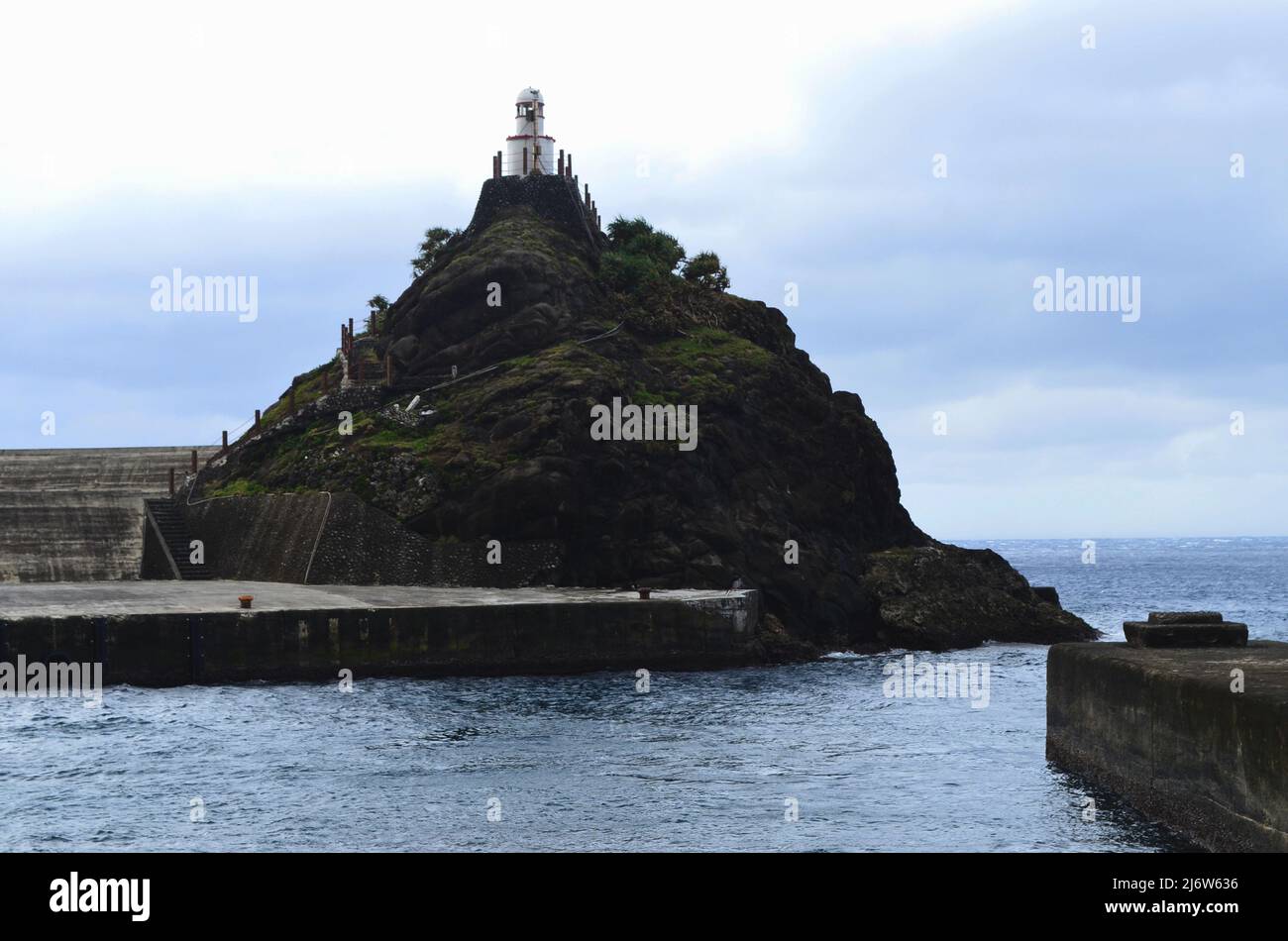 Old Lanyu lighthouse in Kaiyuan harbour, Lanyu island, Taiwan Stock Photo