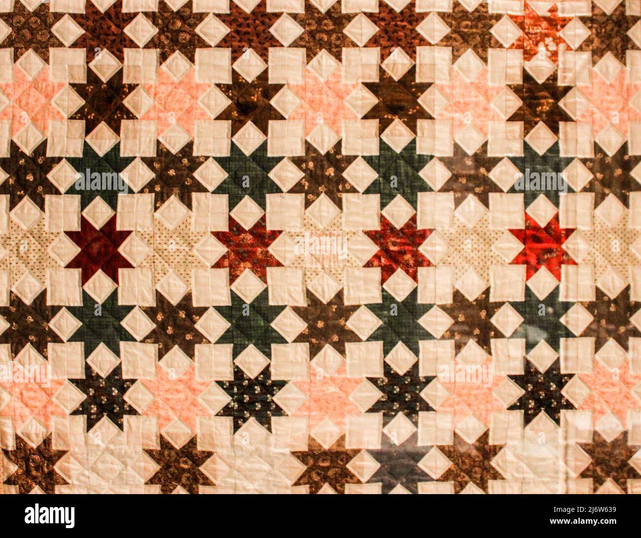 Old pieced star quilt - antique fabric - background Stock Photo