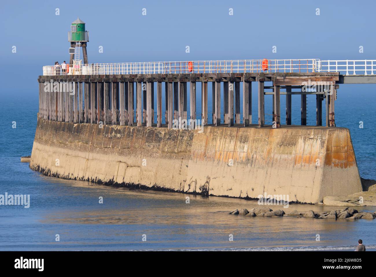 The boardwalk & concrete pillars to the lighthouse on Whitby's outer
