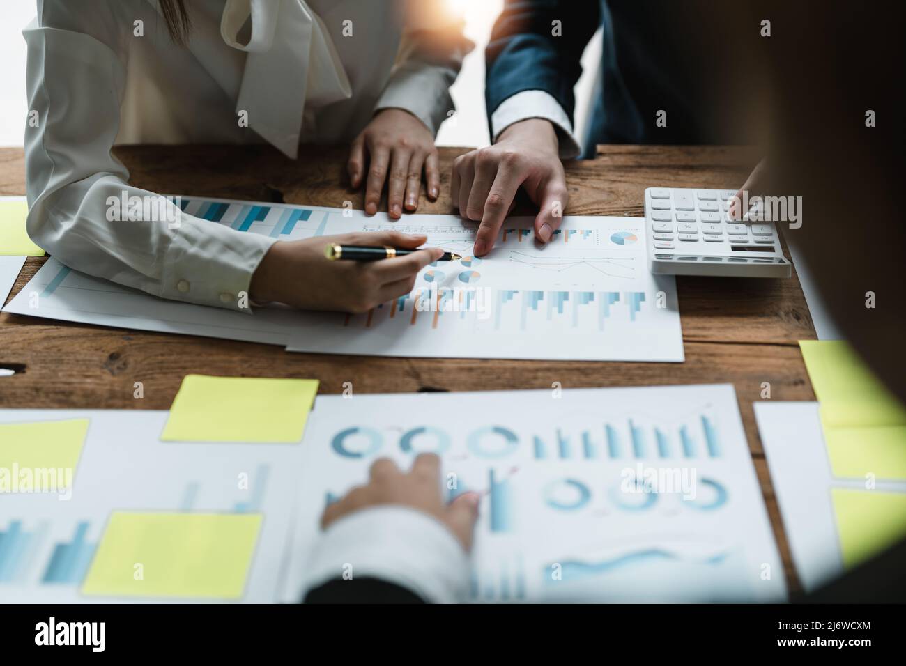 Close up Business People Analyzing Statistics Financial Concept Stock Photo