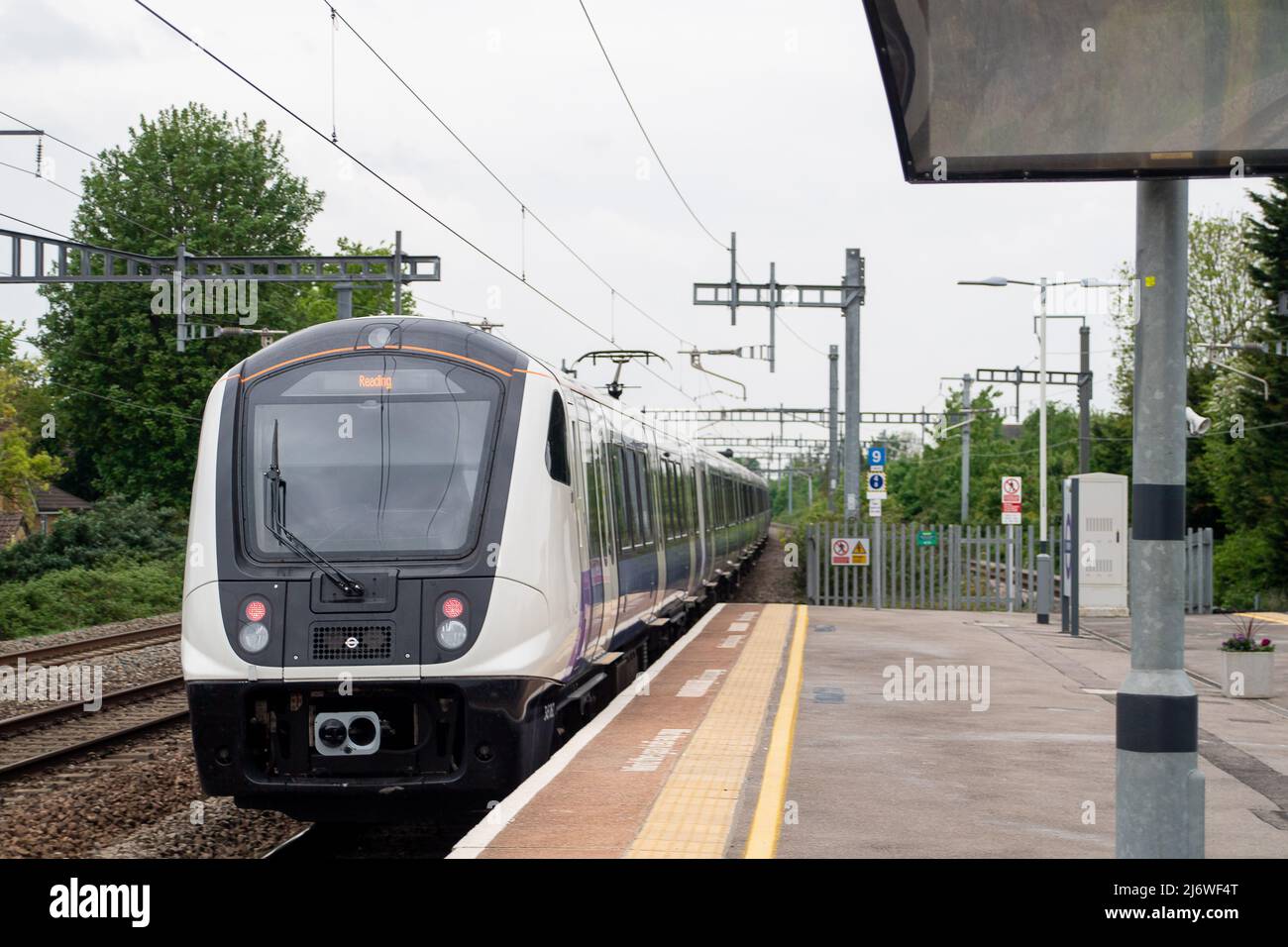 burnham-slough-berkshire-uk-4th-may-2022-an-elizabeth-line-train-passing-through-burnham-station-en-route-to-reading-the-much-delayed-crossrail-project-now-known-as-the-elizabeth-line-is-set-to-start-on-24th-may-2022-credit-maureen-mcleanalamy-live-news-2J6WF4T.jpg