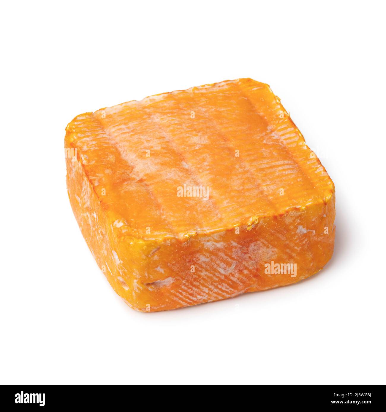 Piece of Le Chandor cheese with an orange crust isolated on white background close up Stock Photo