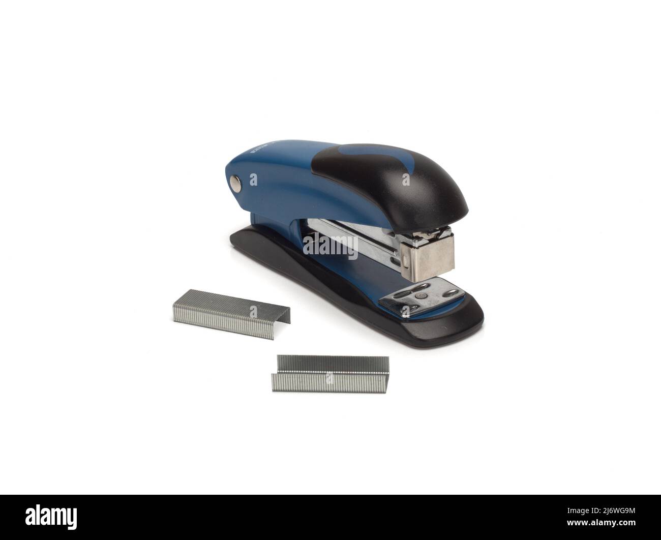 Photo of stapler on a white background and staples nearby Stock Photo
