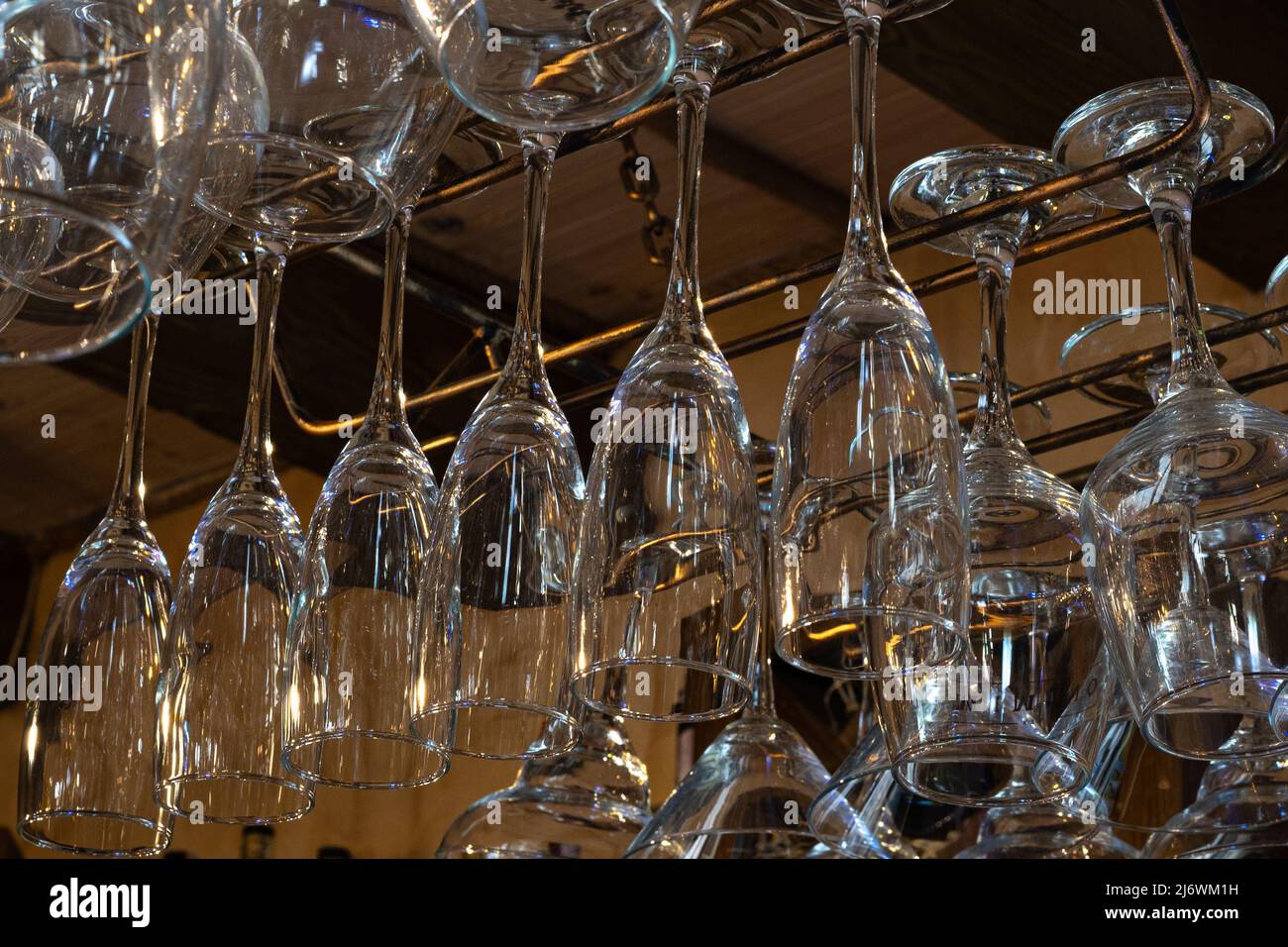 Wine glasses hang upside down. Perfectly clean glass Stock Photo