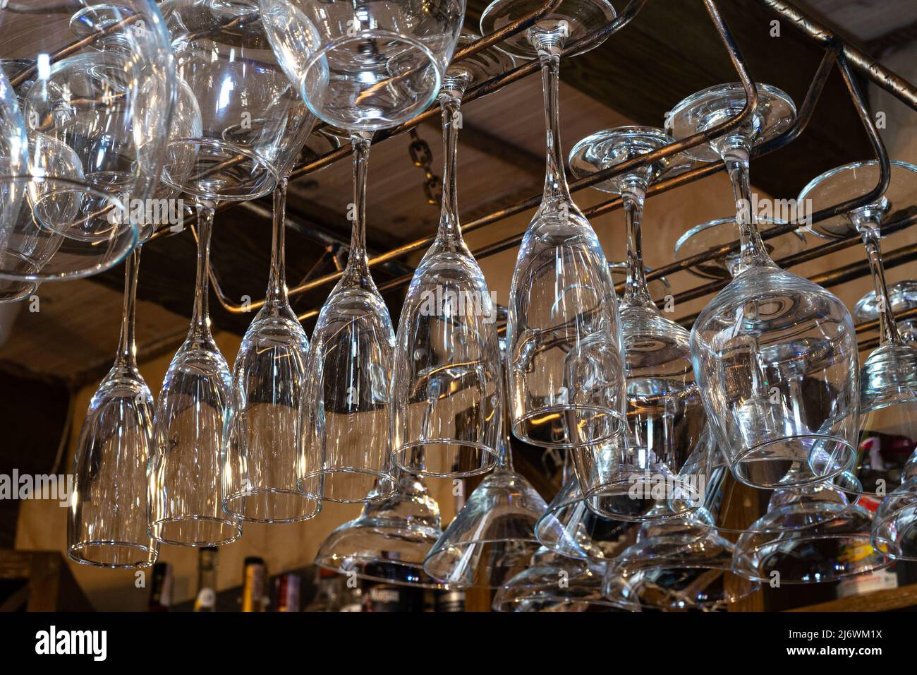 Wine glasses hang upside down. Perfectly clean glass Stock Photo