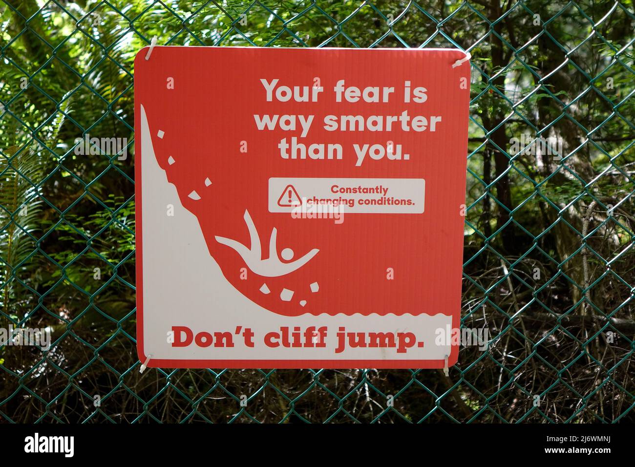 A Warning Sign Fixed To A Fence Advising "Don't Cliff Jump" At Lynn
