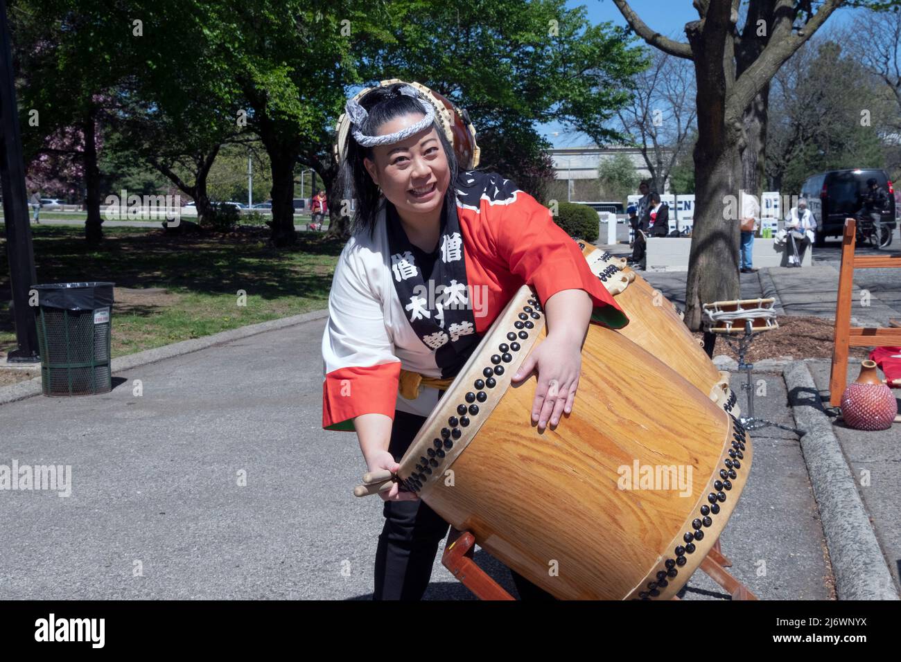 Posed photo off a member of the Soh Daiko Japanese American drum group perform at the Sakura Matsuri celebration In Flushing, Queens, New York City. Stock Photo
