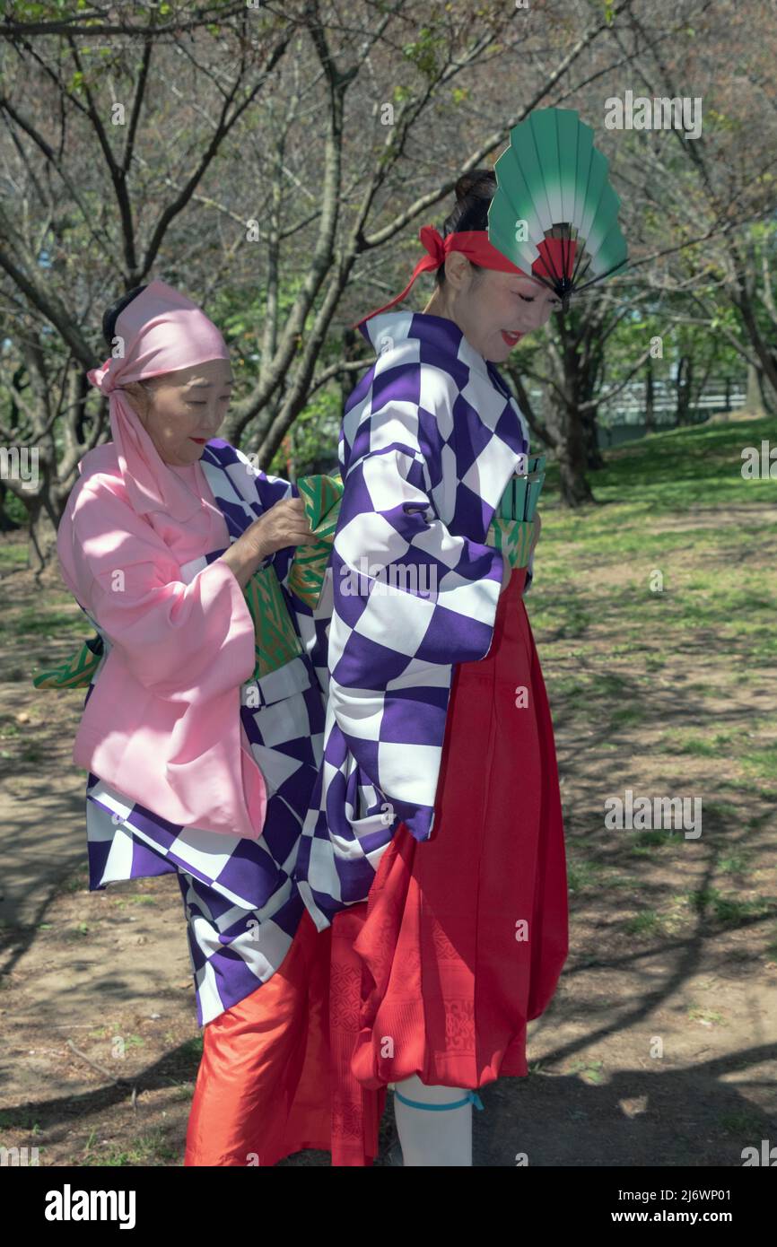 Members of the Japanese Folk Dance institute prepare their costumes for the Sakura Matsuri celebration. In Flushing Meadows Park, Queens, New York. Stock Photo