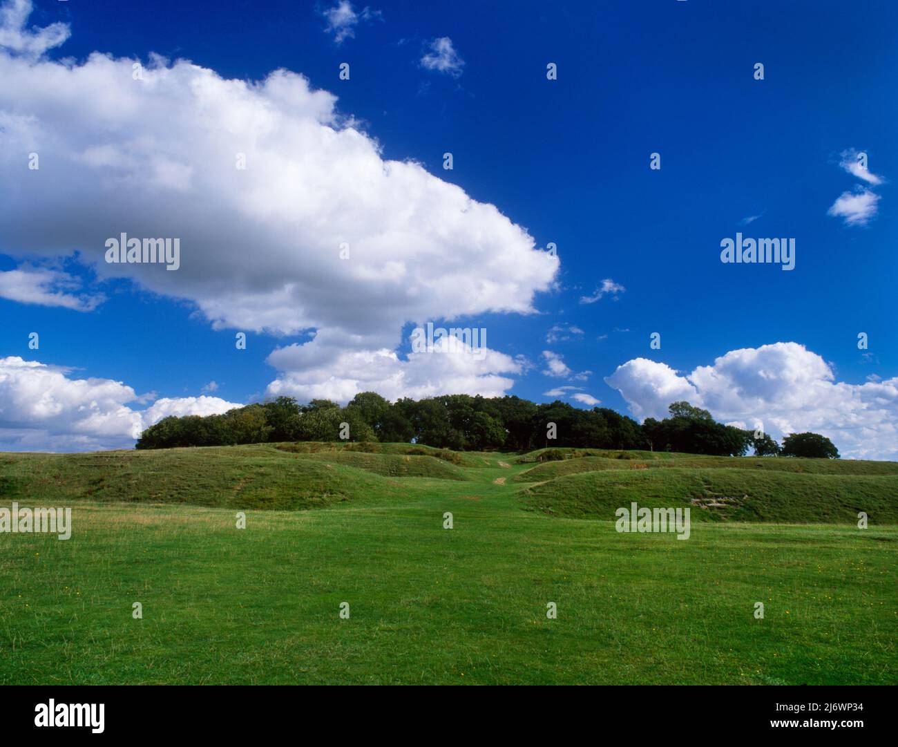 View SE up through the W entrance of Badbury Rings Iron Age hillfort, Kingston Lacy, Dorset, England, UK: original entrance was staggered not straight Stock Photo