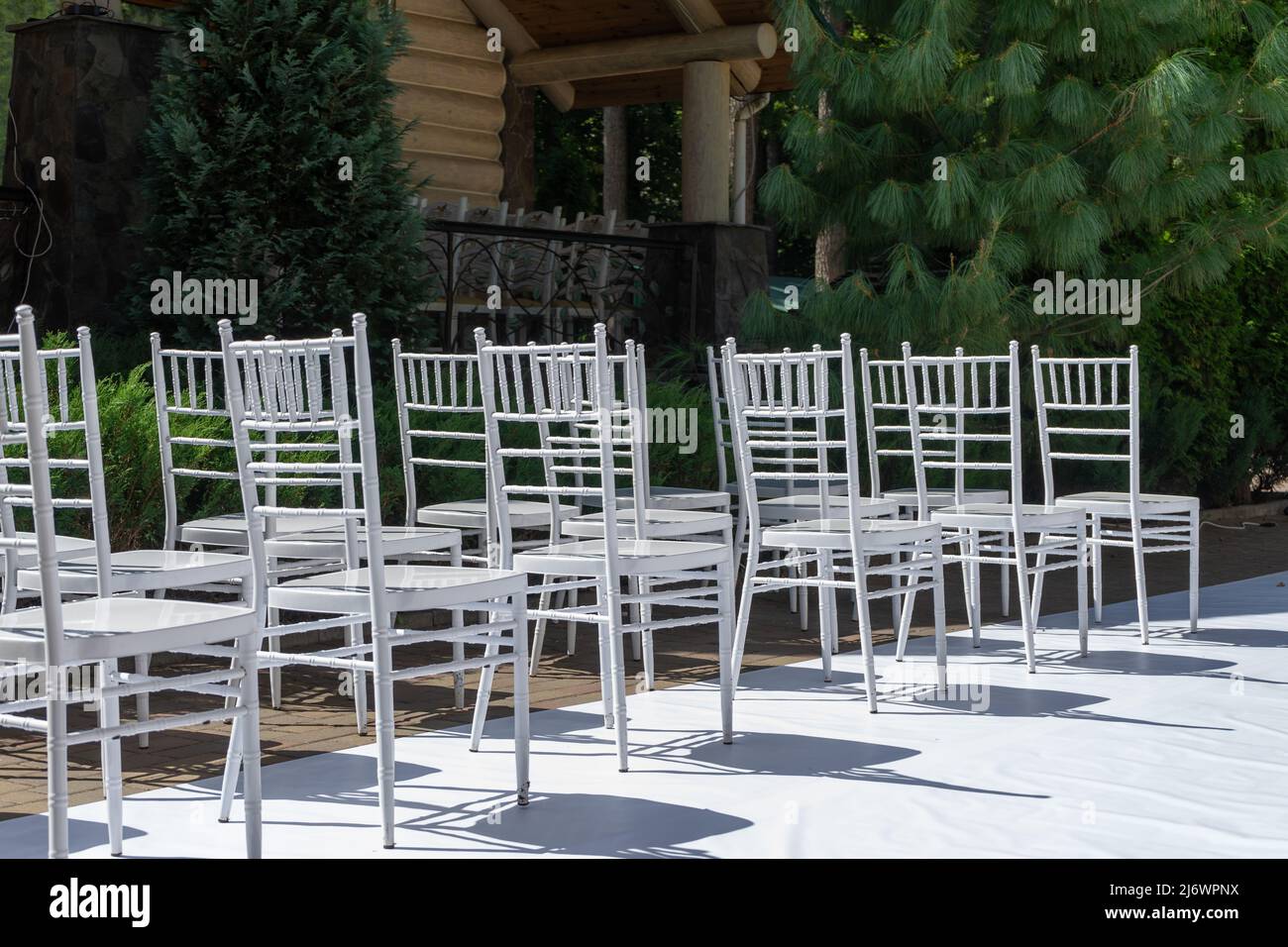 White wooden chairs. Wedding ceremony. Marriage registration. Stock Photo