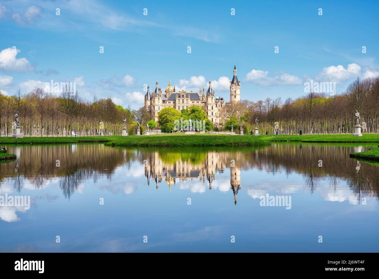 Castle in Schwerin, Germany. Capital of Mecklenburg-Vorpommern state, state parliament. Castle garden, with reflection in the water. Stock Photo