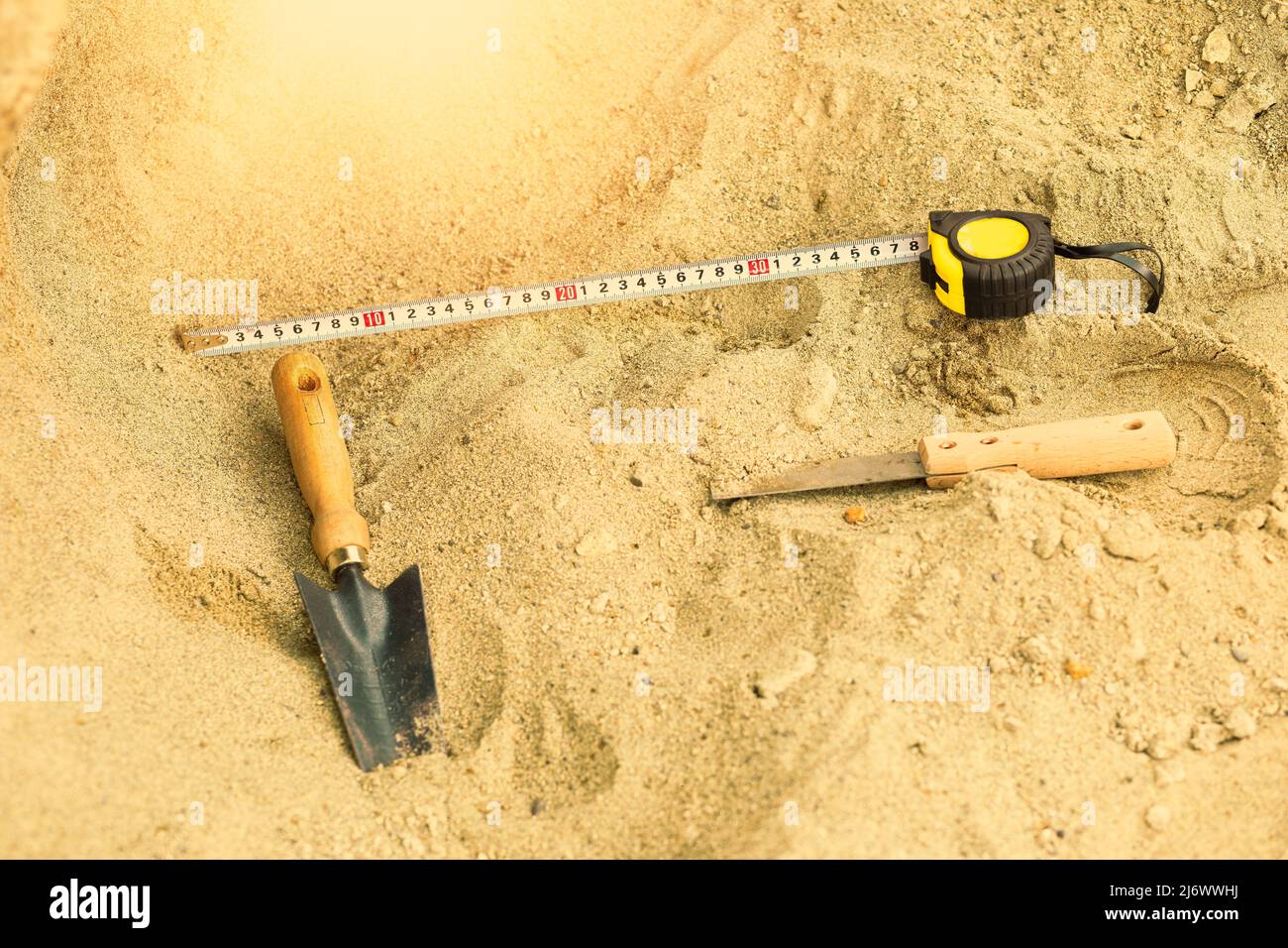 Shovel in the sand.Skeleton and archaeological tools.Digging for