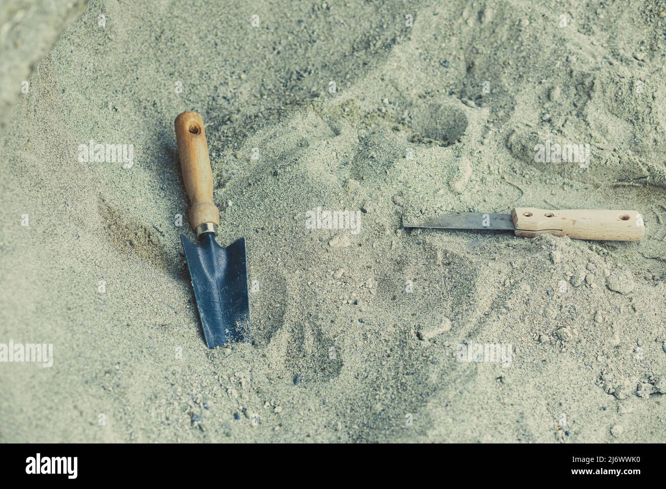 Shovel in the sand.Skeleton and archaeological tools.Digging for