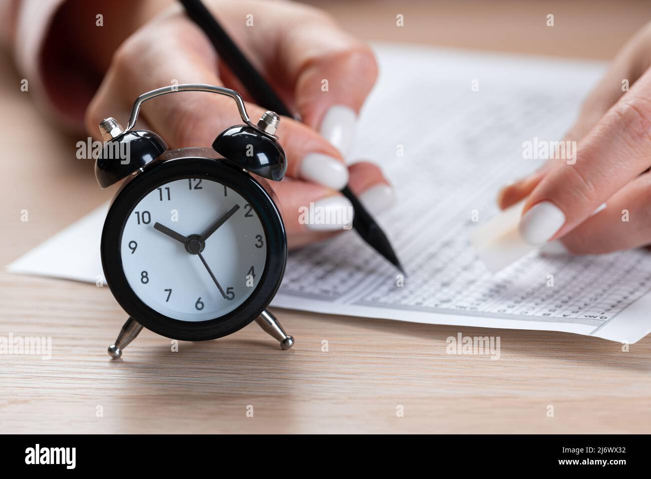 alarm clock for a student writing exams, taking an exam room with a