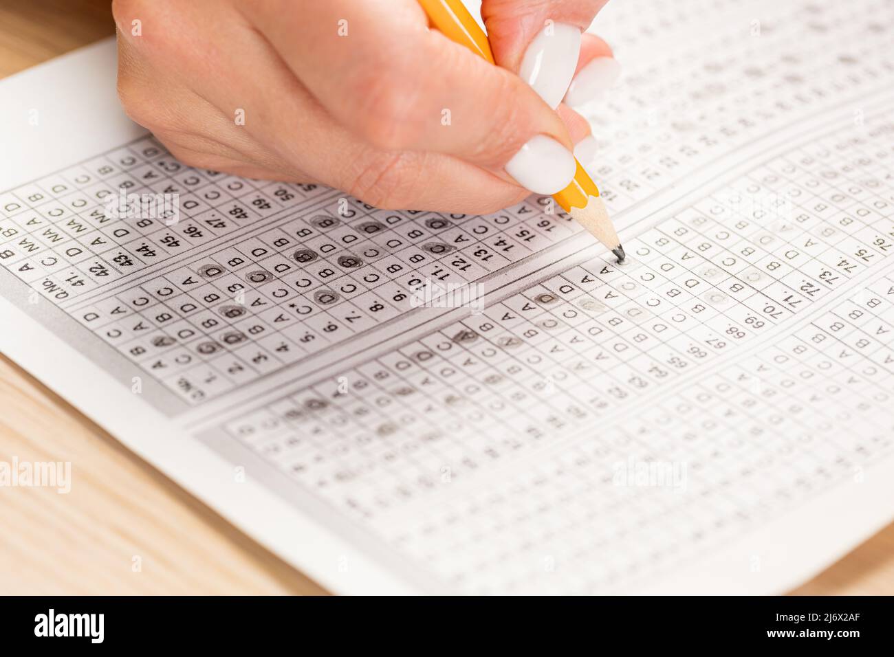 Close up of hands of student doing test. Stock Photo