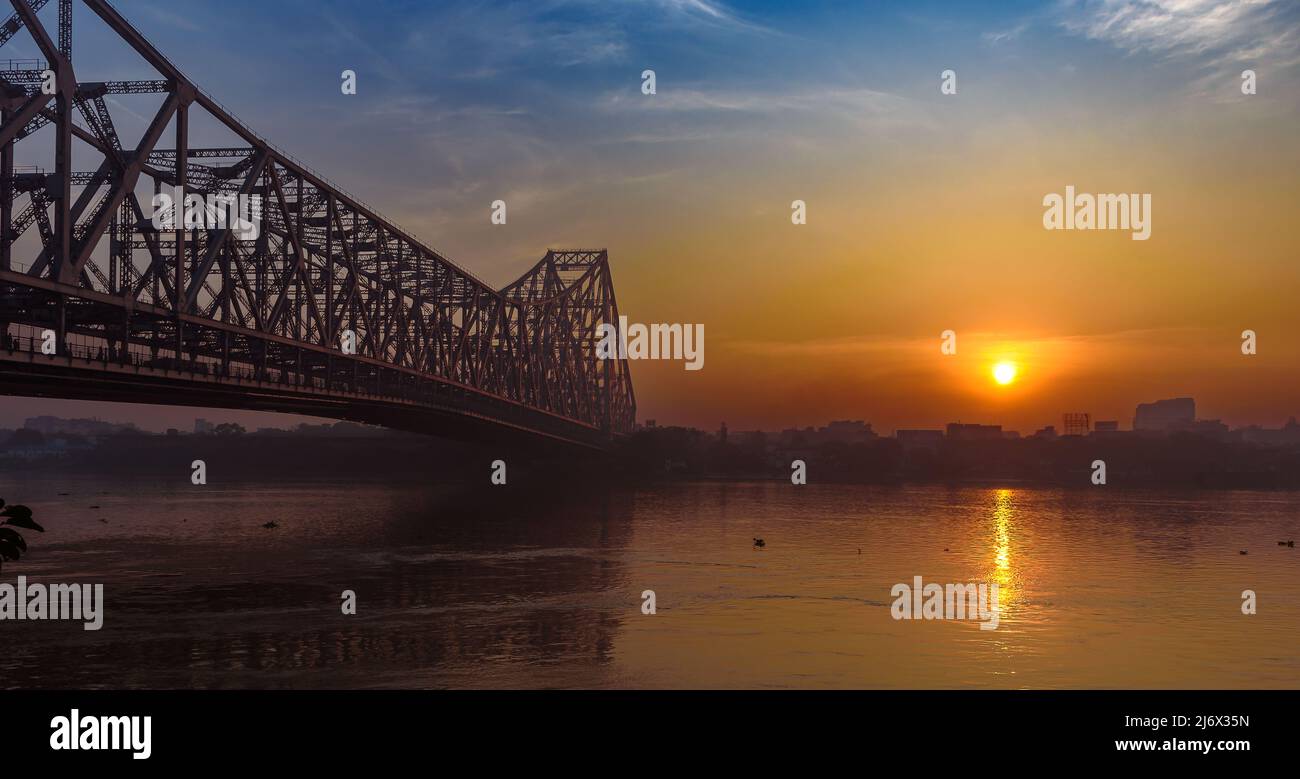 View of Famous Landmark In India, The  Howrah Bridge ,a bridge with a suspended span over the Hooghly River in Kolkata, West Bengal, India. Stock Photo