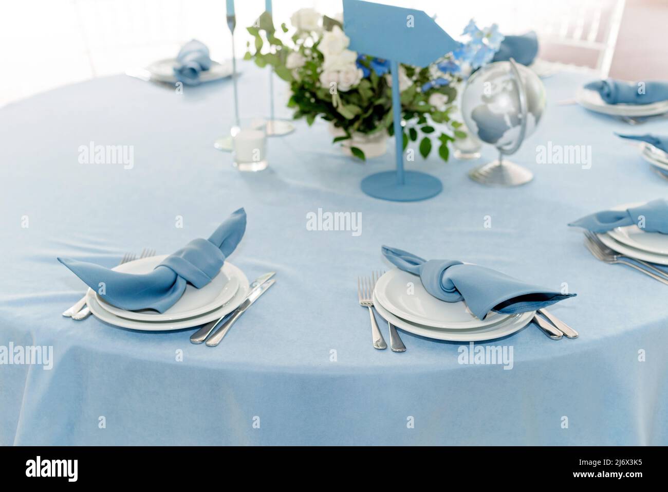 Table setting for holidays and wedding, blue color. A set table for a ...