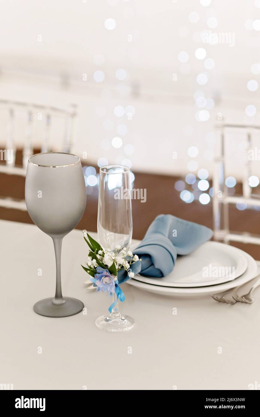 Table setting for holidays and wedding, blue color. A set table for a