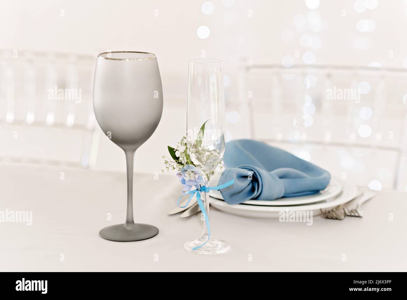 Table setting for holidays and wedding, blue color. A set table for a