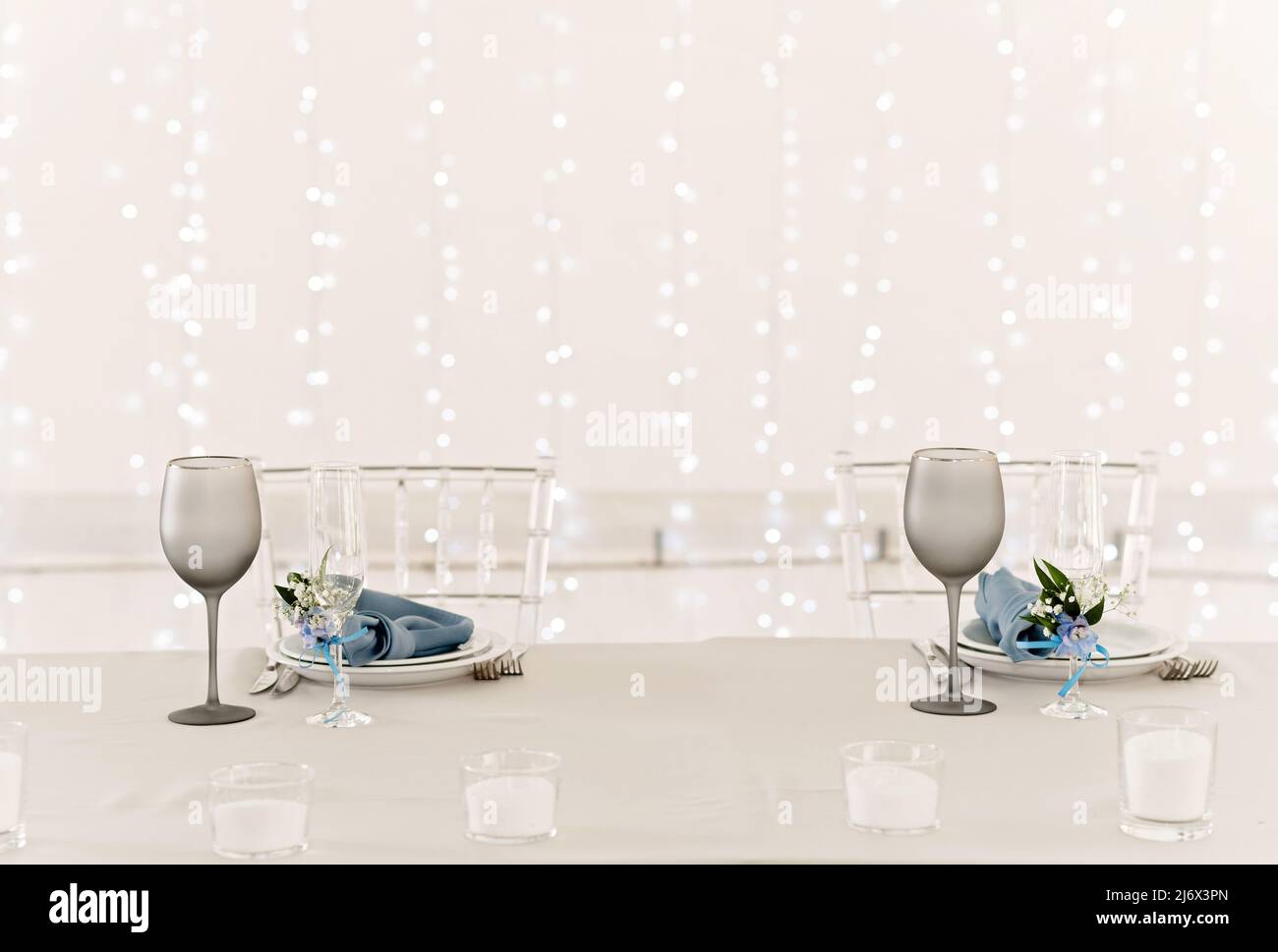 Table setting for holidays and wedding, blue color. A set table for a