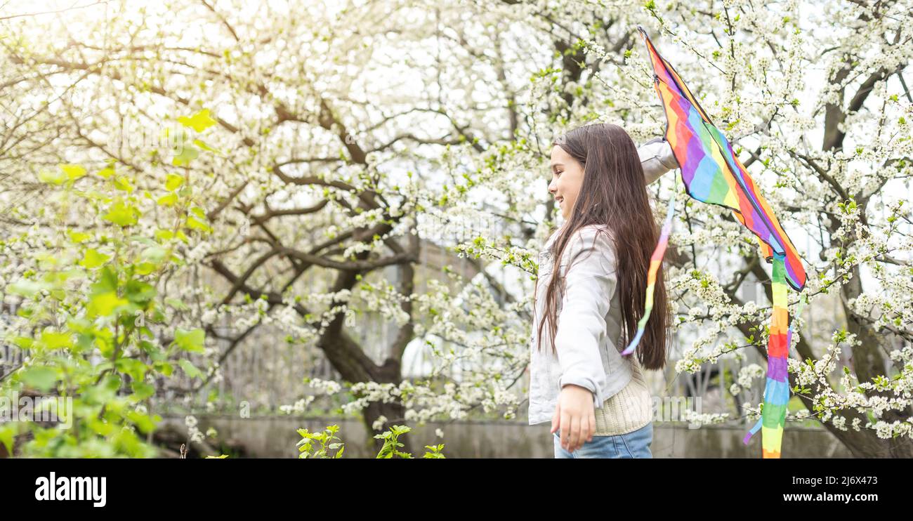 little cute girl flying a kite Stock Photo - Alamy