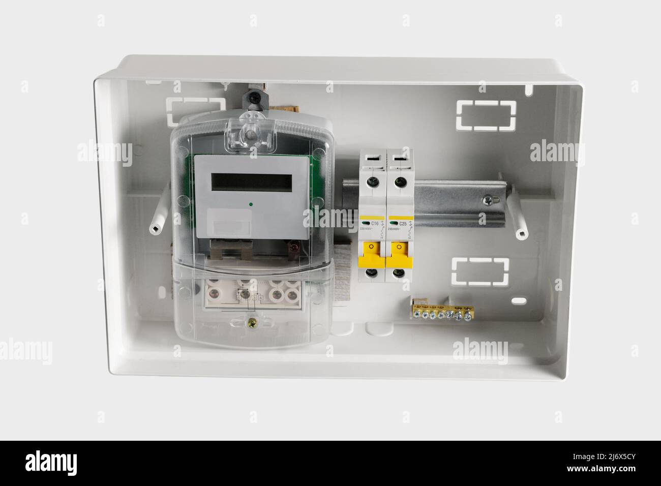Electricity meter in a plastic electrical panel. Stock Photo